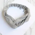 Elastic knitted twist headband in light grey marl with vertical ribbed texture for women - Knitted Light Grey