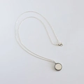 Detailed view of S925 sterling silver necklace featuring a beaded round coin pendant - Round