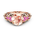 Exquisite rose gold ring with large champagne round stone and pink side zircon accents - US 10 / Rose Gold