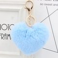 Close-up of a blue heart-shaped fluffy keychain with a golden metal ring and chain - Sky Blue