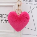 Close-up of pink heart plush keychain with golden metal clasp and fluffy texture - Rose Red