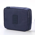 Portable navy blue travel toiletry bag with zipper and embossed aircraft travel icon - Navy Blue