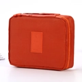 Portable orange nylon travel toiletry bag with handle and zipper closure - Orange