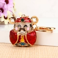 Enameled God of Wealth metal keychain with red finish and sparkling rhinestone details - Single OPP Bag Packaging / Red God of Wealth