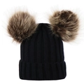 Detailed knit texture of a black baby winter hat featuring dual fluffy faux fur pom poms - S / Black
