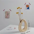 Modern hollow oval beige ceramic vase with matte finish and dried yellow globe flowers - Standing Mountain (Beige)