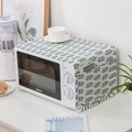 Copertura antipolvere per microonde in lino con foglie, tasche laterali e nappe bianche - Grano Verde