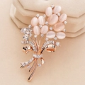 Close-up of elegant flower brooch with pink cat eye stones and sparkling crystals - Pink Bouquet