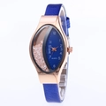 Detail view of rose gold quartz watch with blue snakeskin strap and floating rhinestones - Blue