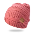 Close-up of deep pink cable knit beanie featuring a stitched C.C. leather logo patch - Pink
