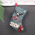 Detail of green burlap Christmas stocking featuring 3D reindeer doll and SNOW wood letter patch - SNOW Letters / Blue Reindeer