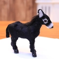Realistic black reindeer figurine ornament with white facial accents standing on platform - Black Donkey / Black
