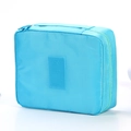 Light blue water-resistant travel wash bag with a PU leather tag and sturdy zipper - Light Blue