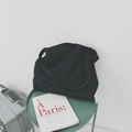 Minimalist large black canvas tote bag shown on a green table with aesthetic props - Black