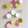 Pink and gold glitter paper circle garland hanging on a light wood background - 2m Glitter Circle Gold & Pink & White Garland