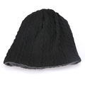 Detailed view of cable knit beanie with warm grey fleece lining for winter protection - Black
