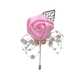 Detail of pink silk rose boutonniere with white pearls and a golden hollow leaf - Pink