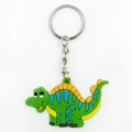 Cartoon green dinosaur PVC keychain with blue stripes and silver metal ring - Green Dinosaur