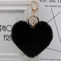 Close-up of a heart-shaped black faux fur keychain with premium gold metal hardware - Black
