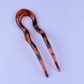 Close-up of U-shaped hairpin showing smooth amber resin and brown tortoiseshell pattern - Classic U-Shaped Style / Dark Leopard Print