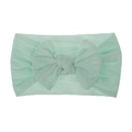 Dettaglio della fascia per neonati in nylon verde menta con grande fiocco e trama elastica - Verde menta