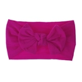 Dettaglio macro della fascia per neonati in nylon morbido con fiocco rosa acceso - Rosso rosa