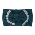 Close-up of soft dark teal nylon baby headband with white lace trim and large bow detail - Aqua Blue