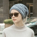 Outdoor portrait of a model wearing a grey knitted slouchy beanie with a textured pattern - Multifunctional Model / Gray