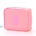Pink travel toiletry bag with grid texture, carry handle and airplane logo design - Light Pink