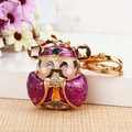 Exquisite gold-plated Caishen keychain with purple enamel and sparkling rhinestones - Single OPP Bag Packaging / Purple God of Wealth