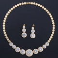 Golden bridal jewelry set with micro-inlaid cubic zirconia necklace and earrings on black - Gold Plated White Zircon
