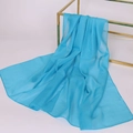 Elegant blue chiffon scarf draped over a gold metal frame on a white background - Lake Blue