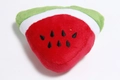 Detail showing plush watermelon slice toy with soft red fabric and embroidered seeds - Red Watermelon Slice