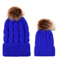 Detail of blue knitted beanies in parent-child set with fluffy faux fur pom-poms - Parent-Child Set / Sapphire Blue