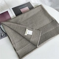 Short taupe knitted scarf made of 100% acrylic wool with a BINUS brand woven label - Lime Grey