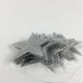 Glittery silver star garland decoration with sparkling finish for party backdrops - 4m Glitter Silver PVC Star Garland