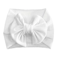 Detailed macro view of a soft white velvet baby headband with a large decorative bow - White