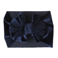 Detail of navy blue velvet baby headband featuring a large bow on white background - Navy Blue