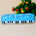 Close-up of blue piano note pencil case with keyboard design on wooden background - Sky Blue