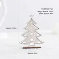 Minimalist wooden Christmas tree ornament with cutout star design on a sturdy base - Christmas Tree
