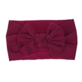Detail of soft nylon baby headband with large dark red bow in comfortable stretch fabric - Burgundy
