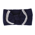 Detailed view of a soft navy blue nylon baby headband with an elegant lace-trimmed bow - Navy Blue