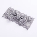 Detailed view of grey lace bow headband featuring intricate floral镂空 patterns - Grey