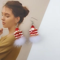 Close-up of strawberry cake earrings with red plaid bow and soft white plush pom-pom - Faux Fur Ball Hook