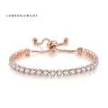 Rose gold adjustable tennis bracelet with 4mm round cubic zirconia on white background - Rose Gold + White