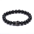 Matzwarte lavasteen kralenarmband met een zwarte micro-pave zirkoon kroonbedel - Matte Zwarte Steen Stijl