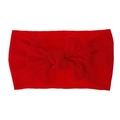 Dettaglio di una fascia per neonati in nylon morbido con un grande fiocco rosso vivo - Rosso