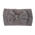 Detailed view of the soft knitted texture and layered bow knot on this grey baby headband - Gray