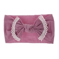 Detail of soft nylon baby headband featuring lace edges and dusty pink knotted bow - Dusty Pink