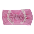 Detail view of pink soft nylon baby headband with lace-trimmed bow and knot. - Deep Pink